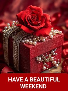 a red box with pearls and a rose on it that says have a beautiful weekend