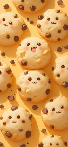 there are many cookies that have chocolate chips on them, and one has a smiling face