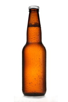 a brown beer bottle with water droplets on the top and bottom, against a white background