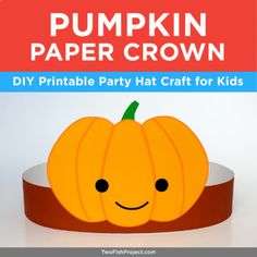 a paper pumpkin sitting on top of a table with the words pumpkin paper crown above it