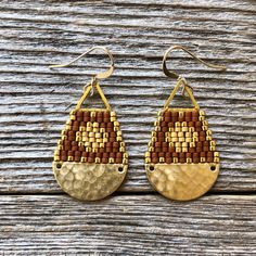 "These beaded teardrop shaped earrings were handwoven one bead at a time with size 11/0 Miyuki glass seed beads. A time intensive and intricate craft, each bead is carefully hand stitched in order to create an evenly woven beaded fabric. The process requires focus, patience and dedication, as even a small pair of beadwork earrings can take hours to complete. I love the contrast with the matte and shiny beads... my favorite! Handwoven Brick Stitch Beadwork Miyuki delica glass seed beads in 24k gold plated matte and shiny 14k gold filled ear wires and findings Raw brass pieces + gold plated triangles Extra durable nylon beading thread Each bead is approx. 1.6mm x 1.3mm Size: 1 1/2\" long (including ear wire) and 3/4\" wide Weight: 2g each (4g/pair)" Beadwork Earrings, Beaded Fabric, Beading Thread, Gold Sun, Fabric Beads, Glass Seed Beads, Seed Bead Earrings, Brick Stitch, Bead Earrings