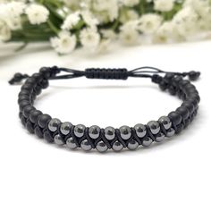 "✦Gemstone: Matte Onyx / Hematite ✦Color: Black ✦Shape: Round  ✦Bead Size: 4mm  ✦QTY: 1 pc / package Description: Elevate your spiritual journey and energy with our handcrafted Macrame Double Layer Beaded Bracelet. This unique piece combines the power of 4mm Matte Onyx and Hematite beads, offering spiritual protection and balance. Experience the beauty of natural gemstones and their harmonious energies. Gemstone Properties: Onyx is revered for its grounding properties, promoting inner strength and stability, while hematite is known for its protective qualities and ability to absorb negative energies. Together, they form a powerful combination that brings balance and harmony to both mind and spirit. Double Layer Design: The double layer design symbolizes layered spiritual protection and bal Bracelet Photo, Gemstone Properties, Beading Jewelry, Hematite Bracelet, Spiritual Protection, Macrame Bracelet, Hematite Beads, Paracord Bracelets, Layer Design