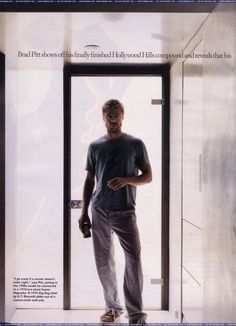 a man standing in front of a door with his hand on his hip and looking at the camera