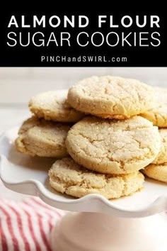 almond floured sugar cookies on a white plate