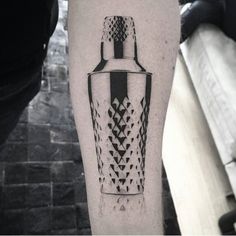 a black and white photo of a bottle on the left leg with an arrow in it