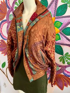 this silk jacket is a one of a kind!✨ hand picked vintage silk from special ethnic places to bring you the most beautiful silky and soft ones we could find 🌞 this jacket is like a piece of art, it has so many details and you will always be the only one to have it. it has a zipper, two front pockets and an inner zipper pocket️ jacket has an inner liar of fleece, so it will keep you cosy and warm in cold winter days. 🌱 you may find some small imperfections on the silk, this should be loved as a Unique Jackets, Rave Clothing, Peacock Pattern, Silk Jacket, Unisex Jacket, Pocket Jacket, Rave Outfits, Jacket Vintage, Winter Days