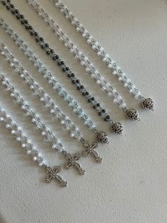 Beaded Cross Necklaces These dainty cross necklaces are fabulous and fun! Add some sparkle to your outfit with this piece. It is available in 2 pendant types and 6 colour ways. Perfect for everyday wear.  Instruction:  1. Please select pendant type (heart or cross)  2. Please select bead colour way. 3. Please select length (most common is 16 inches)  Handmade with Stainless Steel Nickel-free Silver Beaded Cross Necklace For Gift, Silver Crystal Beaded Necklace With Gemstone Beads, Cross-shaped Faceted Beads For Jewelry Making, Beaded Cross Pendant Necklace As A Gift, Silver Beaded Cross Pendant Necklace, Silver Cross Beaded Necklace For Spiritual Style, Silver Spiritual Cross Beaded Necklace, Spiritual Silver Cross Beaded Necklace, Silver Spiritual Crystal Necklace With Beaded Chain