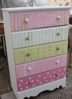 a pink and green dresser with polka dots on it