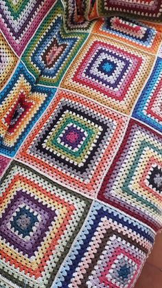 a crocheted blanket with squares on it