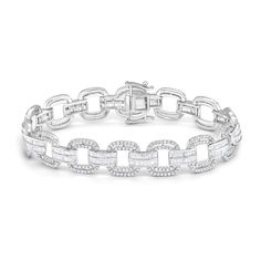 Turn heads with the refined yet dazzling design of this diamond cushion and bar link bracelet in white gold. Crafted in cool 10K white gold Open cushion-shaped links sparkle with round diamonds around inner and outer borders. Two rows of channel-set baguette-cut diamonds line each of the bar-shaped connector links. Impressive with 5 cts. t.w. of diamonds This 7.0-inch bracelet secures with a box clasp. Silver Round Diamond Bracelet With Baguette Diamonds, Anniversary Diamond Bracelet With Rectangular Links, Classic Silver Diamond Bracelet With Baguette Diamonds, Diamond Tennis Bracelet With Rectangular Links And Diamond Accents, Tennis Bracelet With Diamond Accents And Rectangular Links, White Diamond Baguette Cut Bracelet, Diamond Bracelets With Rectangular Links For Anniversary, Classic Cubic Zirconia Diamond Bracelet With Rectangular Links, White Diamond Bracelet With Baguette Cut