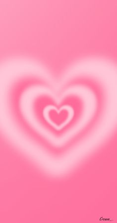 a heart shaped object on a pink background