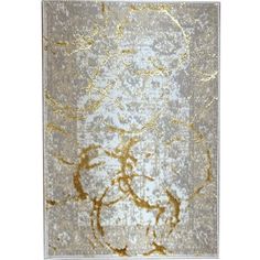 an area rug with gold and white designs on the ground, in front of a white background