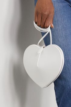 White Le Coeur leather shoulder bag | ALAÏA | NET-A-PORTER Heart-shaped Leather Shoulder Bag, Everyday Use Heart-shaped Leather Shoulder Bag, Chic Heart-shaped Leather Bag, Evening Heart-shaped Leather Shoulder Bag, Heart-shaped Leather Evening Shoulder Bag, Leather Shoulder Bag With Detachable Strap For Valentine's Day, Leather Heart-shaped Bag With Adjustable Strap, Valentine's Day Leather Shoulder Bag For Evening, Leather Shoulder Bag For Evening And Valentine's Day