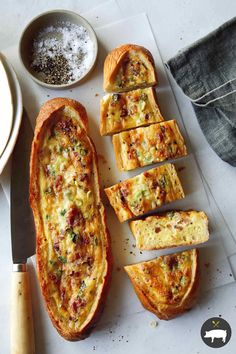 the bread is cut up and ready to be served with other ingredients on the table