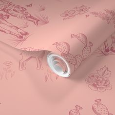 a pink wallpaper with flowers and animals on it's side, next to a roll of tape