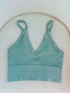 Introducing the Kalani Tank in Vintage Sage. This seamless tank top features a vintage wash for a unique and stylish look. Crafted with quality and comfort in mind, this tank will elevate your wardrobe and provide a smooth, flattering fit. Perfect for any occasion. one size fits all but fits sizes XS-XL best ✨ Comfortable Seamless Summer Tank Top, Comfortable Seamless Tank Top For Summer, Seamless Comfortable Summer Tank Top, Summer Seamless Comfortable Tank Top, Acid Wash Stretch Tops For Spring, Green Cotton Tank Top With Built-in Bra, Cotton Tank Top With Tank Straps For Yoga, Cotton Tank Top For Yoga, Trendy Soft-washed Tank Top For Spring