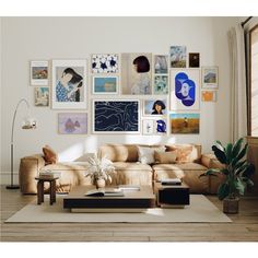 a living room filled with furniture and lots of pictures on the wall above it's coffee table