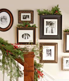 christmas decorations are hanging on the wall next to pictures and wreaths, along with other holiday decor