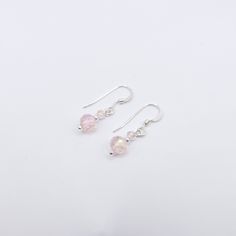 Style: Dangle Material: Sterling Silver Dainty and minimal, yet elegant! Can be worn on any occasion. Thank you for stopping by! Single Feminine Sterling Silver Earring, Minimalist Crystal Drop Earrings With Ear Wire, Minimalist Crystal Drop Earrings, Elegant Pink Earrings For Everyday Wear, Pink Elegant Everyday Earrings, Elegant Pink Everyday Earrings, Minimalist Nickel Free Drop Crystal Earrings, Minimalist Sterling Silver Drop Crystal Earrings, Minimalist Sterling Silver Drop Earrings