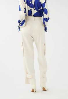 A refined and elegant take on combat pants, these cotton mix trousers have mid thigh side pockets, pleats at the front and a loose fit straight leg. The neutral cream color makes them versatile and chic.Fit: Loose FitSizing: Front: 109 cm Back: 109 cmThe model is 178 cm and uses a size SMaterials: Crepe Viscose Blend 73% polyester,23% viscose, 4% elastaneHow to Wash: Dry clean only Combat Pants, Cream Color, Straight Leg, Loose Fitting, Trousers, Pants, Color