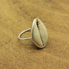 SOLnSILVER Handmade Authentic Gemstone Bohemian 925 Silver Jewelry Sterling Silver Ring, 925 Silver Dainty Bezal Ring, Cowrie Shell Minimalistic Ring, Etsy Silver Gift Ring, Beach Person Gift Item, FreeShip  - Stone Polish - High - Silver Polish - High - Stone Name -  Cowrie Shell - Stone Shape -  Shell - Design Shape -  Shell - Stone Color - Yellow , White   - Stone Category - Cabochon - Metal - Sterling Silver - Metal Purity - 925 parts per 1000 Why To Wear Silver As a metal, silver has significant health benefits that have been used across cultures for centuries. Silver has a proven track record as a powerful antimicrobial agent fighting infections and aiding in cold and flu prevention, wound healing, and more. Silver also helps with internal heat regulation and circulation. Why To Wear Sterling Silver Beach Ring Jewelry, Sterling Silver Beach Ring, Beach Sterling Silver Ring, Silver Stackable Jewelry For Beach, Stackable Silver Jewelry For The Beach, Nickel Free Sterling Silver Rings For Beach, Nickel-free Sterling Silver Rings For The Beach, Minimalist Silver Rings For The Beach, Handmade Rings For Beach