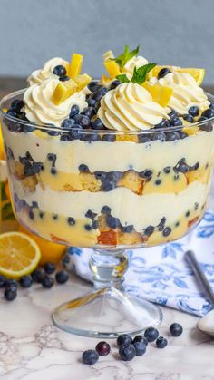 a trifle with blueberries, lemons and whipped cream