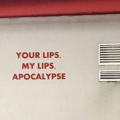 a sign on the side of a building that says, your lips, my lips, apocatypse