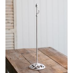 an umbrella stand on top of a wooden table