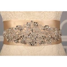 This Gorgeous B525 Embellished Bridal Sash Is Brand New And Ready To Wear! The Champagne Embellished Sash Belt Is A Perfect Accessory For Your Wedding Gown, Bridesmaid Dress, Or Formal Attire! The Sash Features Gorgeous Crystal Beadwork And Embroidery. It Has Just The Right Amount Of Sparkle For Your Special Day! Original Retail Price: $710.00 Fabric: Champagne Swiss Double Faced Satin Size: 3 31/2″ Wide By 3 Yards Long Details: Crystal Beadwork And Embroidery * The Gown In The Photos With This Elegant Silver Bedazzled Sash, Elegant Bedazzled Silver Sash, Elegant Silver Bedazzled Sashes, Elegant Bedazzled Silver Sashes, Elegant Bedazzled Wedding Sash, Silver Bedazzled Bridal Belt For Wedding, Elegant Silver Embellished Bridal Belt, Embellished Silver Bridal Belt, Silver Embellished Bridal Belt