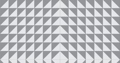 a gray and white pattern with triangles