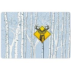 a yellow deer crossing sign in front of some birch trees with snow on the ground