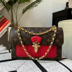 Brand New In Box Comes With Dustbag, Box And Receipts Hard To Take Pictures Of The Date Code. Length: 10.25 In Height: 6.5 In Width: 3.25 In Drop: 12.25 In Drop: 22 In This Chic Shoulder Bag Is Crafted Of Louis Vuitton Monogram Coated Canvas With A Cross-Over Flap. The Bag Features Polished Brass Bijoux Chain Link Shoulder Straps And A Facing Brass Press-Lock For The Flap. This Opens To A Front Patch Pocket And A Partitioned Black Microfiber Interior With A Zipper Compartment. Make A Reasonable Luxury Red Bag With Lock, Elegant Red Bags With Lock, Formal Monogram Canvas Box Bag, Luxury Red Box Bag With Dust Bag, Red Luxury Box Bag For Travel, Luxury Red Box Bag For Travel, Luxury Red Box Bag For Gift, Luxury Red Box Bag With Gold-tone Hardware, Luxury Red Box Bag With Detachable Strap