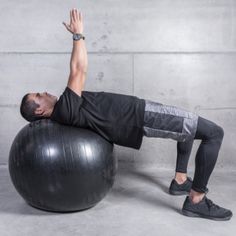 a man is doing exercises on an exercise ball