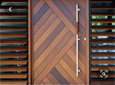 a close up of a wooden door with slats