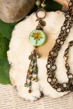 A fun tassel necklace that is longer in design for the Rustic Creek Collection. Handcrafted with Czech glass, turquoise, jasper and featuring a Czech glass dragonfly focal. This artisan design is longer in style resting at 33.25". Antique brass (lead and nickel free) Czech Glass, Turquoise, Jasper 33.25" We hand select our natural materials, thus there may be slight variations in color and/or size that will not detract from the overall aesthetic Our unique handcrafted designer jewelry for women Czech Beads Jewelry Necklaces, Czech Glass Beads Jewelry, Repurposed Accessories, Czech Beads Jewelry, Beaded Projects, Glass Dragonfly, Czech Glass Necklace, Czech Glass Jewelry, Boho Necklaces