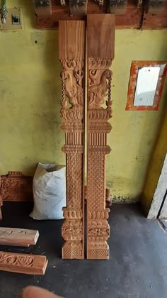 an intricately carved wooden pillar in a room