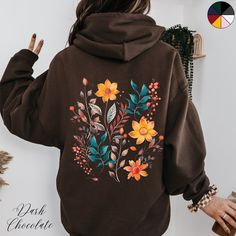 Autumnal Boho Wildflower Unisex Back Graphic Hoodie | Cottagecore Hoodie | Botanical Flower Hoodie | Nature Lover Hoodie | Floral Hoodie Gift ✔️ Design on back only ✔️ Soft, warm and cosy heavy blend unisex hoodie  ✔️ Classic Fit ✔️ Fiber composition: 50% Cotton, 50% Polyester ✔️ Medium-heavy fabric (8.0 oz/yd² (271 g/m   ✔️ Spacious kangaroo pouch pocket  ✔️ Adjustable hood with self-coloured woven drawstring cord ✔️ No side seams ✔️ Tear away label ✔️ Made using 100% ethically grown US cotton Brown Drawstring Hood Sweatshirt For Spring, Brown Hoodie Sweatshirt For Spring, Brown Hooded Sweatshirt For Spring, Long Sleeve Floral Print Hoodie For Fall, Brown Cotton Hoodie For Spring, Fall Floral Print Hooded Hoodie, Winter Floral Print Hoodie Sweatshirt, Cotton Hoodie With Floral Print For Fall, Winter Floral Print Cotton Hoodie