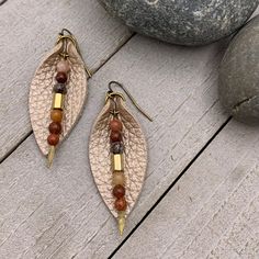 "Add a little boho flair to your day with genuine leather earrings. Champagne beige leather petal is accented with genuine Jasper and bronze glass bead on antique gold arrowhead pin. Lightweight earrings are perfect for everyday. - Earrings dangle just under 2\" on antique gold plated steel wires. - Handmade and ships from Florida" Leather Jewelry Tutorials, Leather Jewelry Making, Beaded Braclets, Leather Jewelry Diy, Petal Earrings, Diy Jewelry Earrings, Diy Bracelet Designs, Accessories Diy Jewelry, Lightweight Earrings