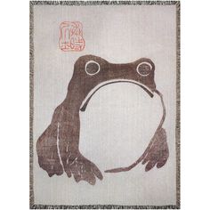 a close up of a cloth with a frog on it