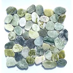 a pile of rocks sitting on top of a white surface