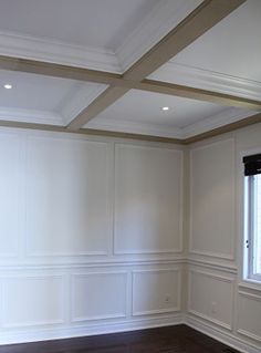 an empty room with wood flooring and white paint on the walls is pictured in this image