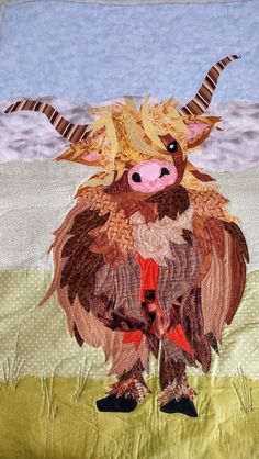 an animal made out of fabric with horns on it