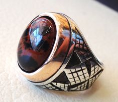 mahagony obsidian stone natural gem sterling silver 925 ring brown and black oval semi precious cabochon man ring jewelry with bronze frame Risk free Quality guarantee policy : If you are not satisfied with your item for any reason simply send it to us and you will get a replacement or refund . please choose your size with the order and we will size it for you . Our ring is handcrafted mostly with a few simple tools . but some methods are used in casting like lost wax method . sterling silver 92 Brown Sterling Silver Signet Ring With Polished Finish, Brown Gemstone Signet Ring, Brown Sterling Silver Cabochon Ring, Brown Sterling Silver Ring With Cabochon, Handmade Oval Brown Rings, Handmade Brown Oval Ring, Brown Oval Cabochon Rings, Handmade Brown Signet Ring As Gift, Handmade Brown Signet Ring For Gift