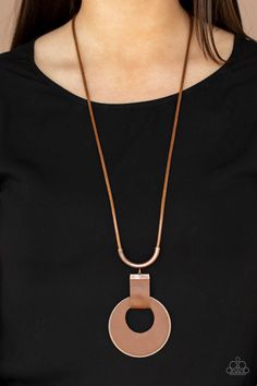 A large cutout copper disc, overlaid with brown leather, is cradled in a wide brown leather strap. The luxe pendant sways from a U-shaped copper cylinder threaded along the end of a lengthened polished brown cord for an indulgently lavish finish. Features a sliding bead closure. 1081 Sold as one individual necklace. Includes one pair of matching earrings. Brown Leather Necklace, Necklace Leather, Paparazzi Accessories, Disc Necklace, Brown Leather Strap, Copper Necklace, White Rhinestone, Paparazzi Jewelry, Jewelry Inspo