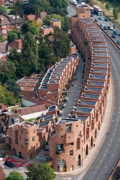 an aerial view of a city with cars on the road