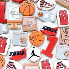 cookies decorated to look like basketballs and sports jerseys with the number one on them