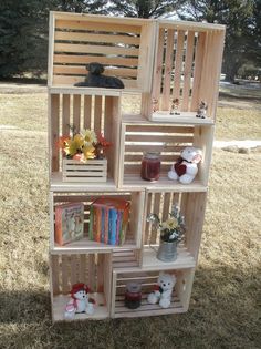 a wooden book shelf filled with books and stuffed animals