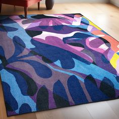 a colorful area rug with an abstract design