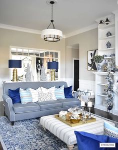 a living room with blue and white decor