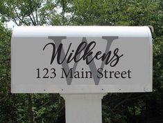 a white mailbox with the words williams street on it's front and side